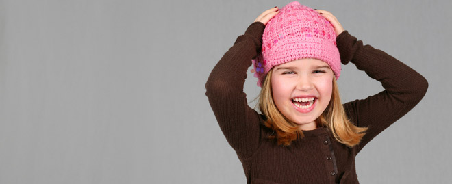 child in pink hat